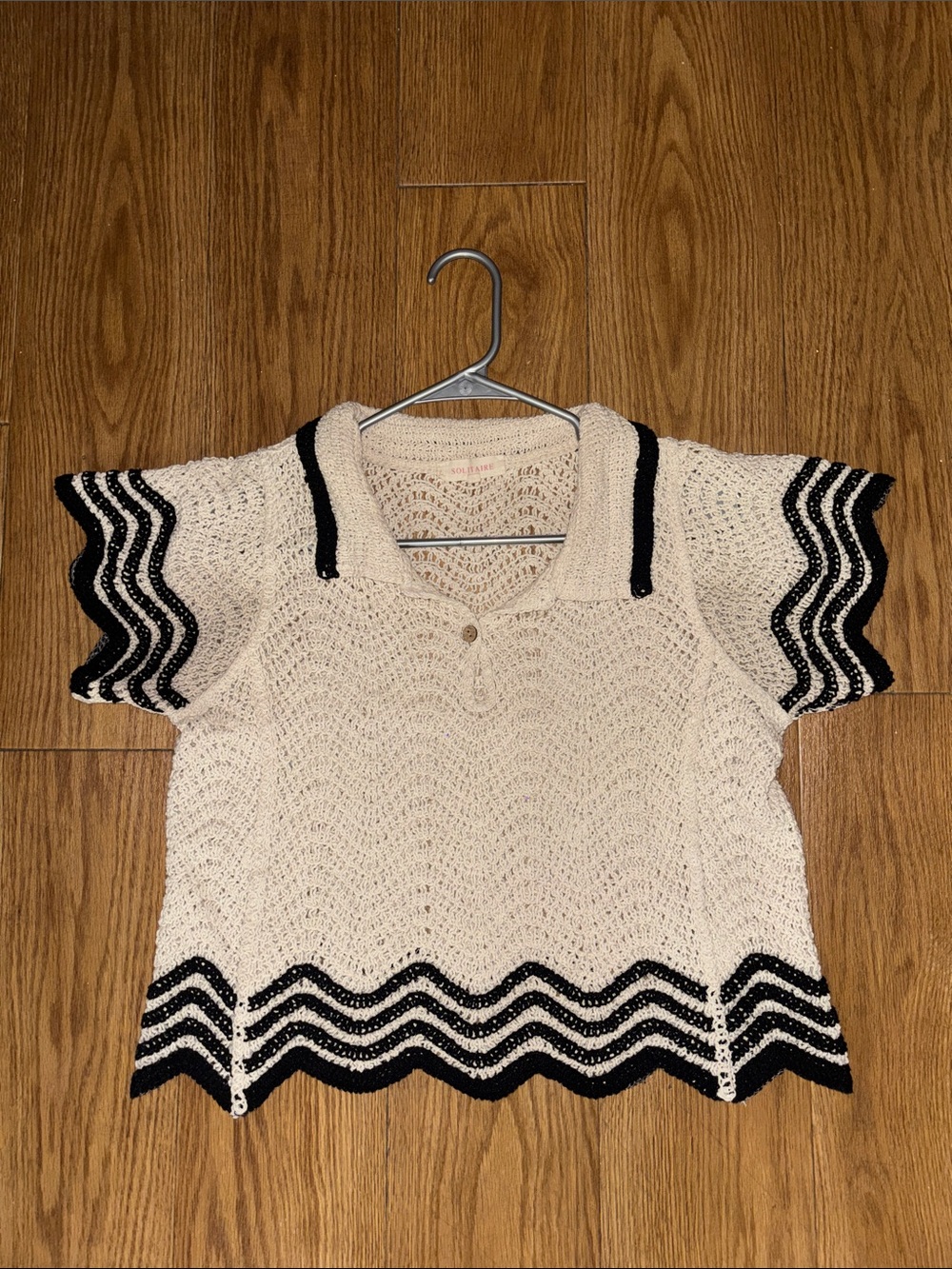 Solitaire Cream Knit Polo Top with Black Wave Trim